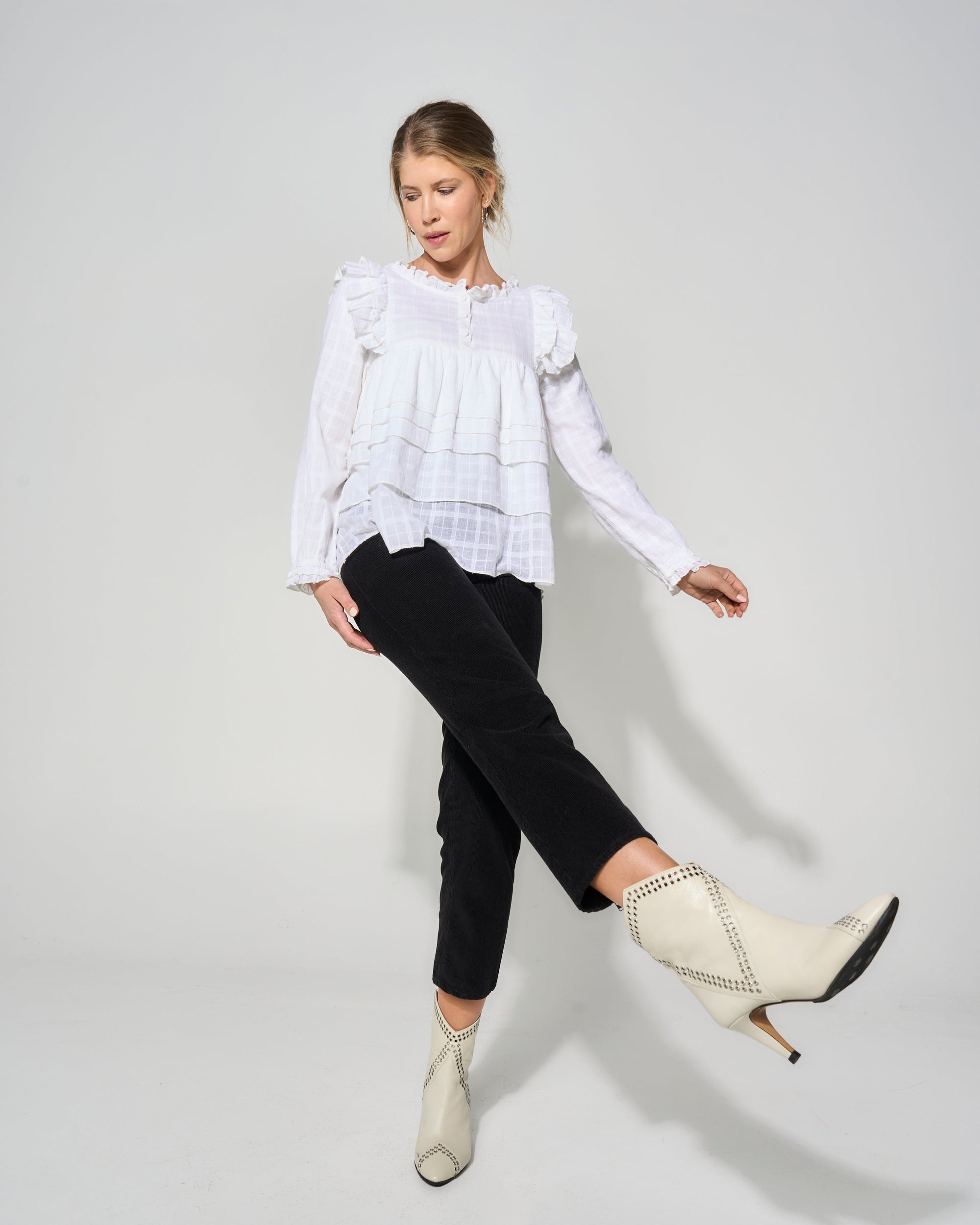 Luxury cream tiered blouse with ruffled shoulders, romantic frilled details, premium textured cotton by GILD at brixbailey.com