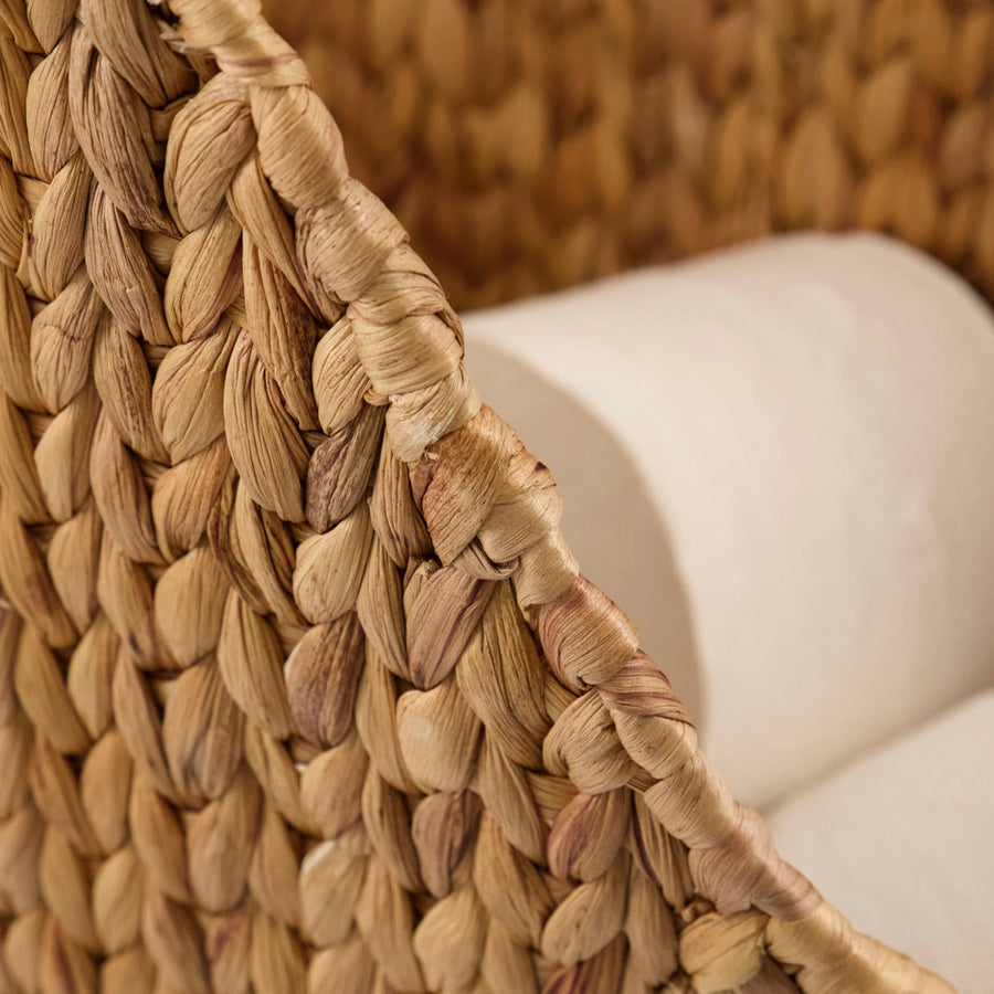 Luxury handwoven water hyacinth toilet paper holder, stylish modern bathroom storage with wooden handle, natural woven basket design by Ella James at brixbailey.com