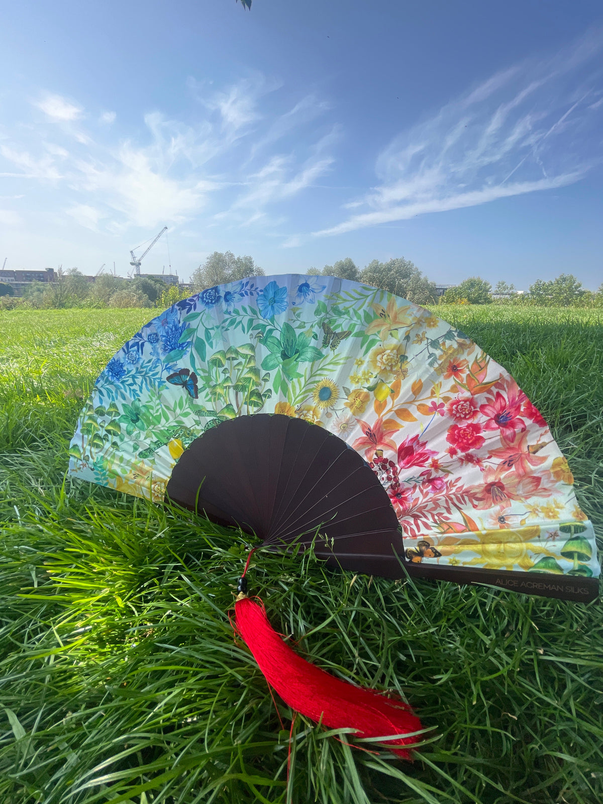 Colourful Silk folding hand fan 'kaleido-bloom' print with floral &amp; nature filled rainbow design