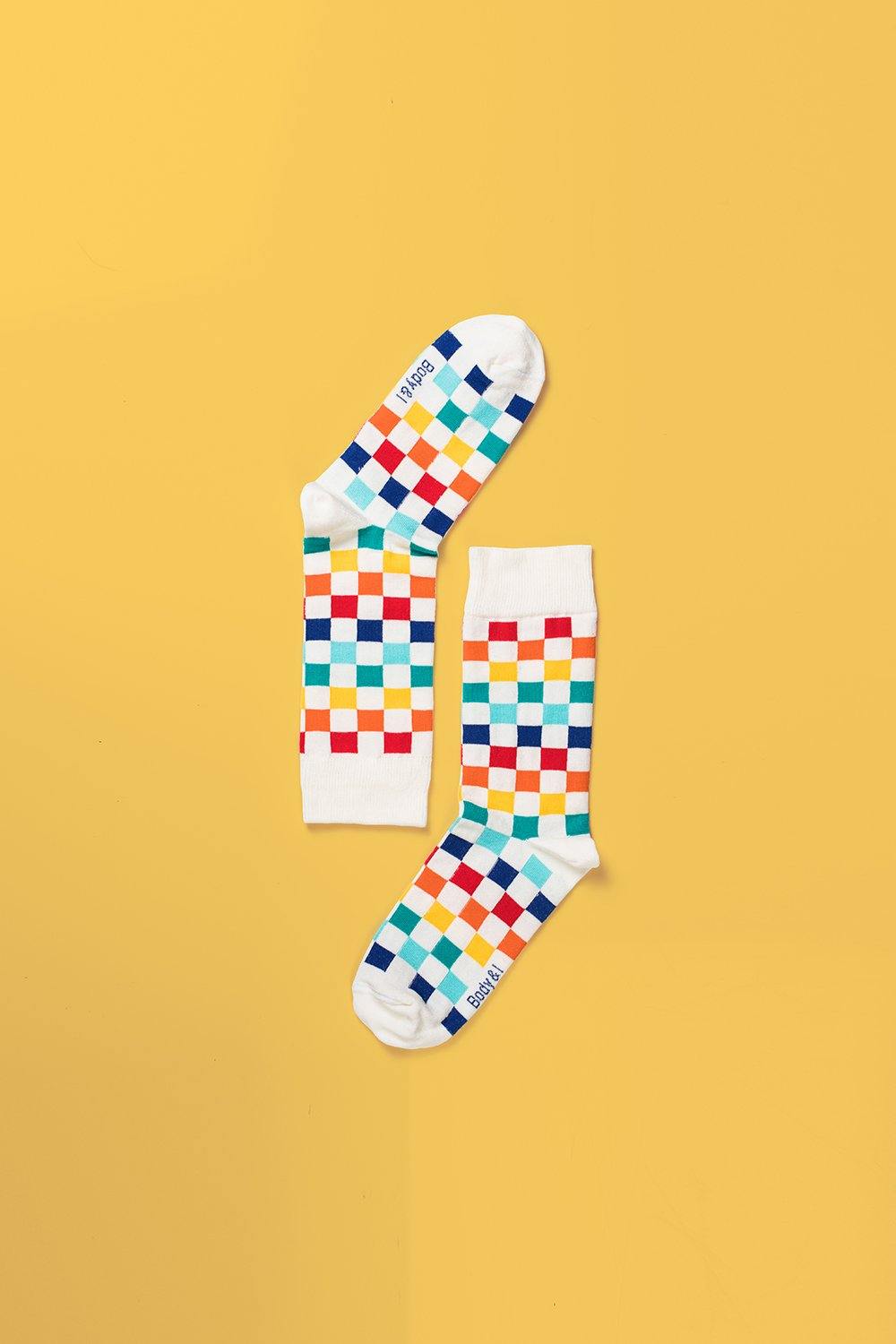 Colorful checkered socks, premium cotton blend, playful luxury design, best-selling stylish unisex footwear, trendy square pattern, sizes 4-8 UK by Body and I at brixbailey.com