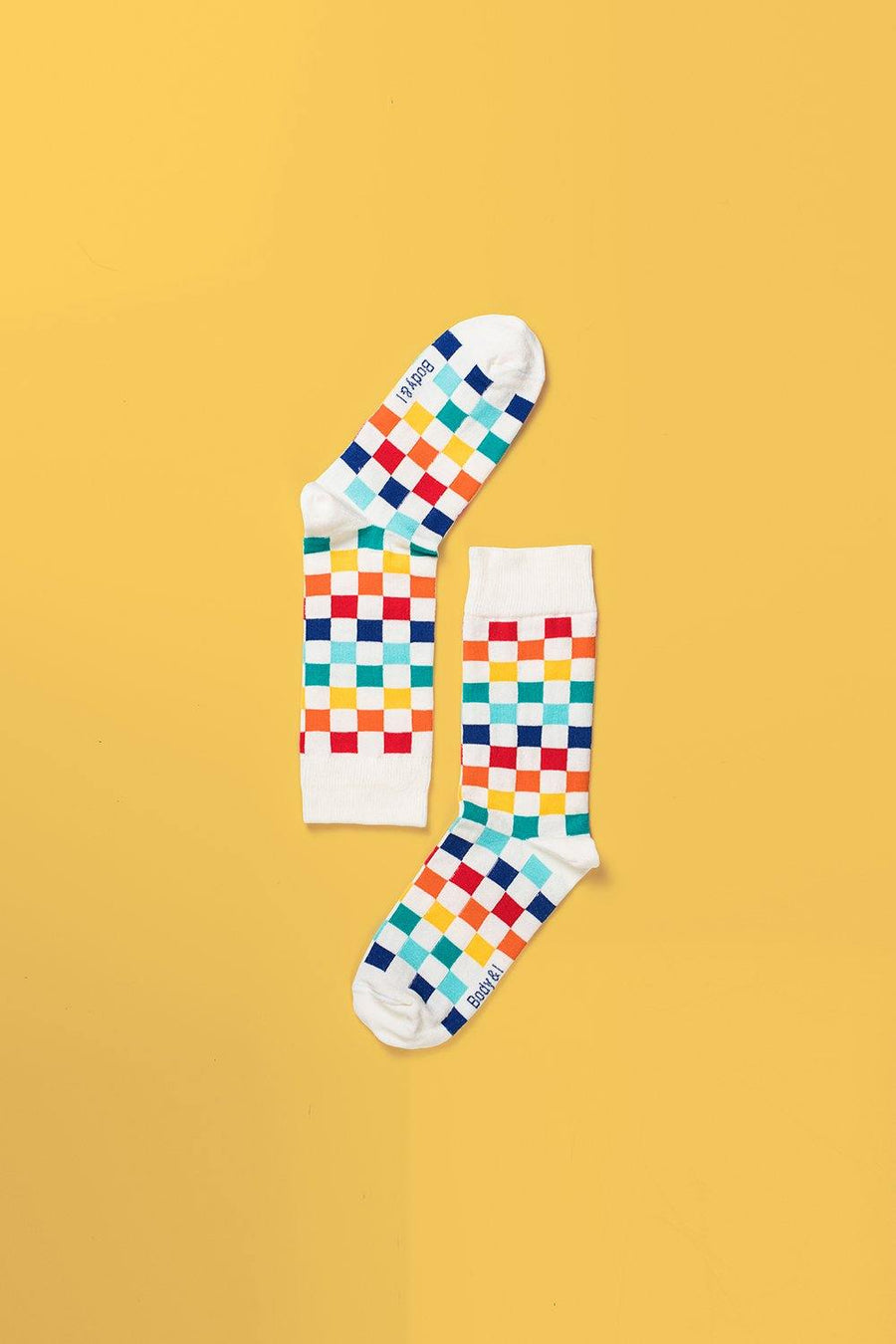 Colorful checkered socks, premium cotton blend, playful luxury design, best-selling stylish unisex footwear, trendy square pattern, sizes 4-8 UK by Body and I at brixbailey.com