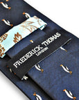 navy tie with penguin design