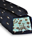 navy tie with penguin design