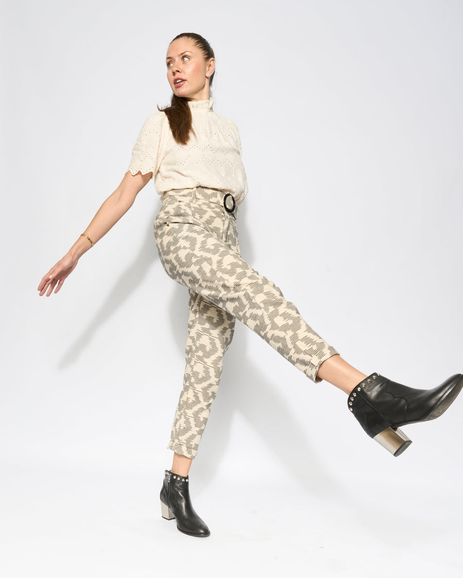 Premium tapered pleat pants with high waist, feminine fit, and versatile cropped or long hem, crafted from 100% cotton IKAT fabric by GILD at brixbailey.com