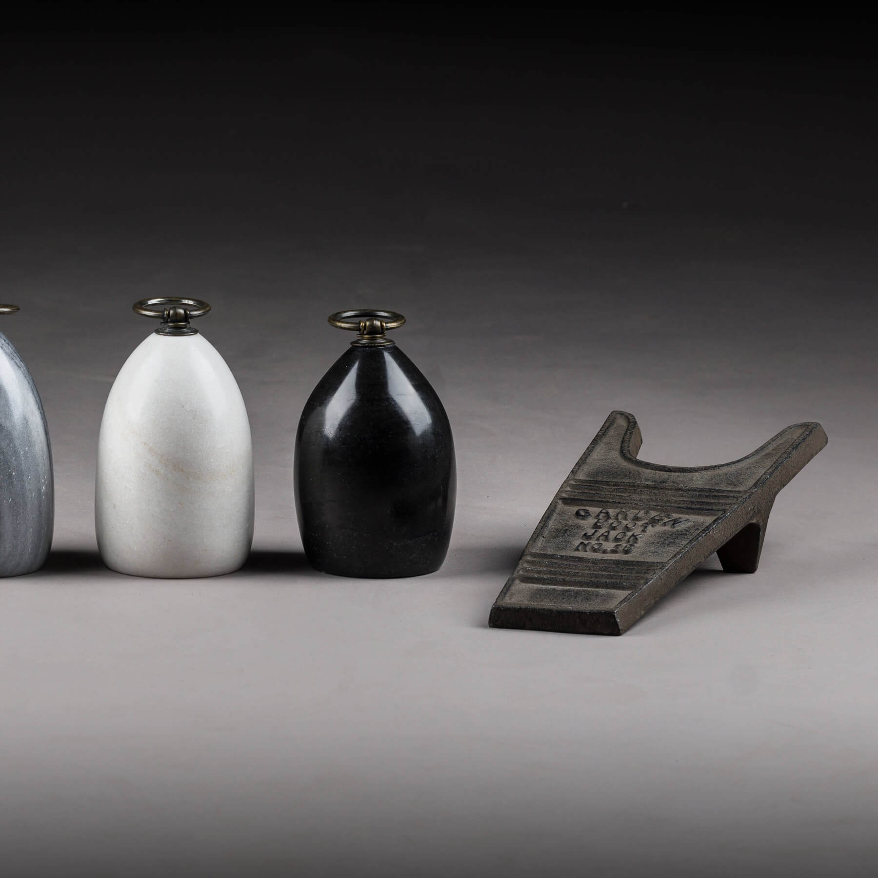 Handcrafted cast iron boot jack in rich brown, rustic texture for effortless boot removal, durable entryway decor by RoomLondon at brixbailey.com