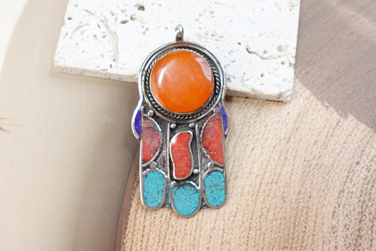 Silver Plated Tibetan Hamsa pendants.