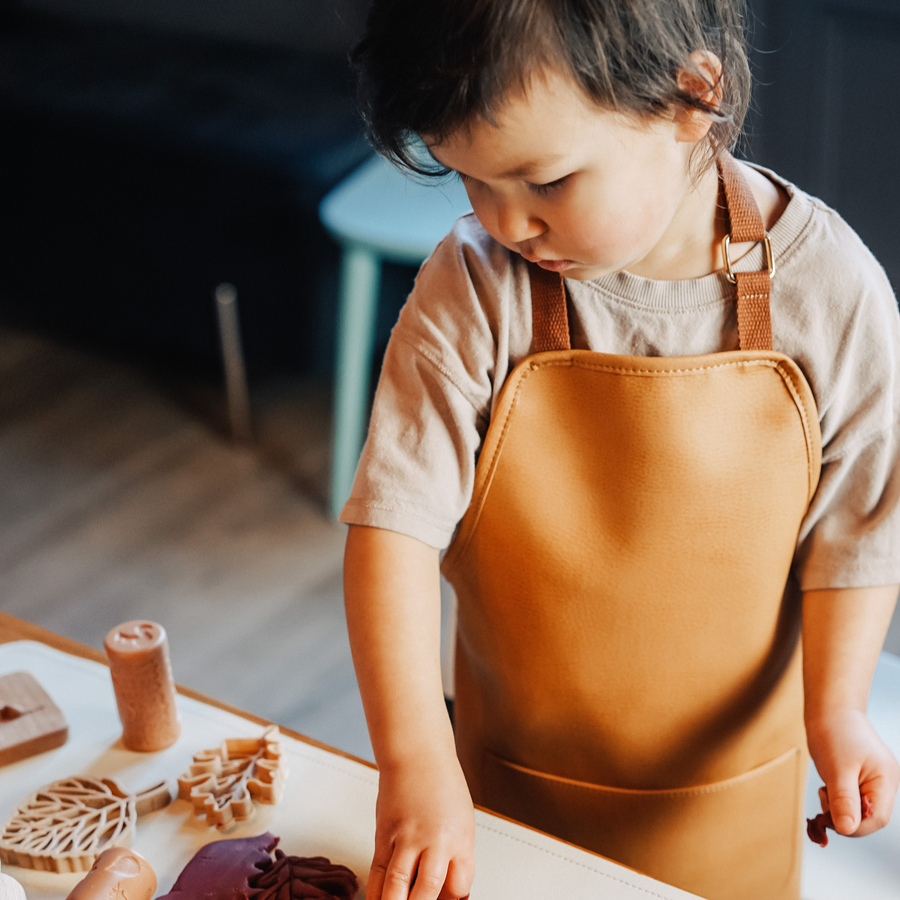 Premium Vegan Leather Apron for Crafts, Baking, and Sensory Play with Adjustable Strap and Front Pocket by Vincabel's Playground at brixbailey.com