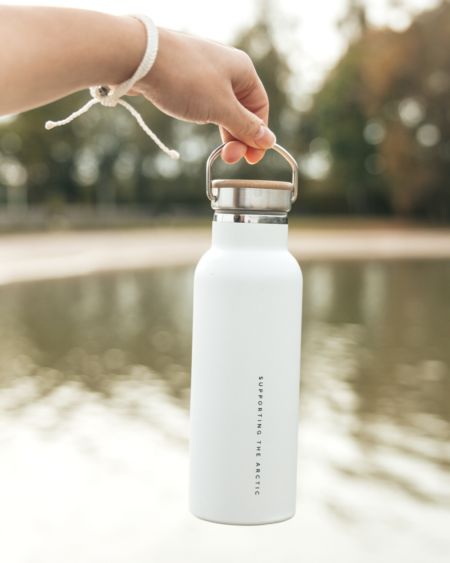 Premium Arctic Bottle, double-wall vacuum-insulated stainless steel, keeps drinks hot or cold, eco-friendly bamboo lid, leak-proof, BPA-free by Arcticus at brixbailey.com