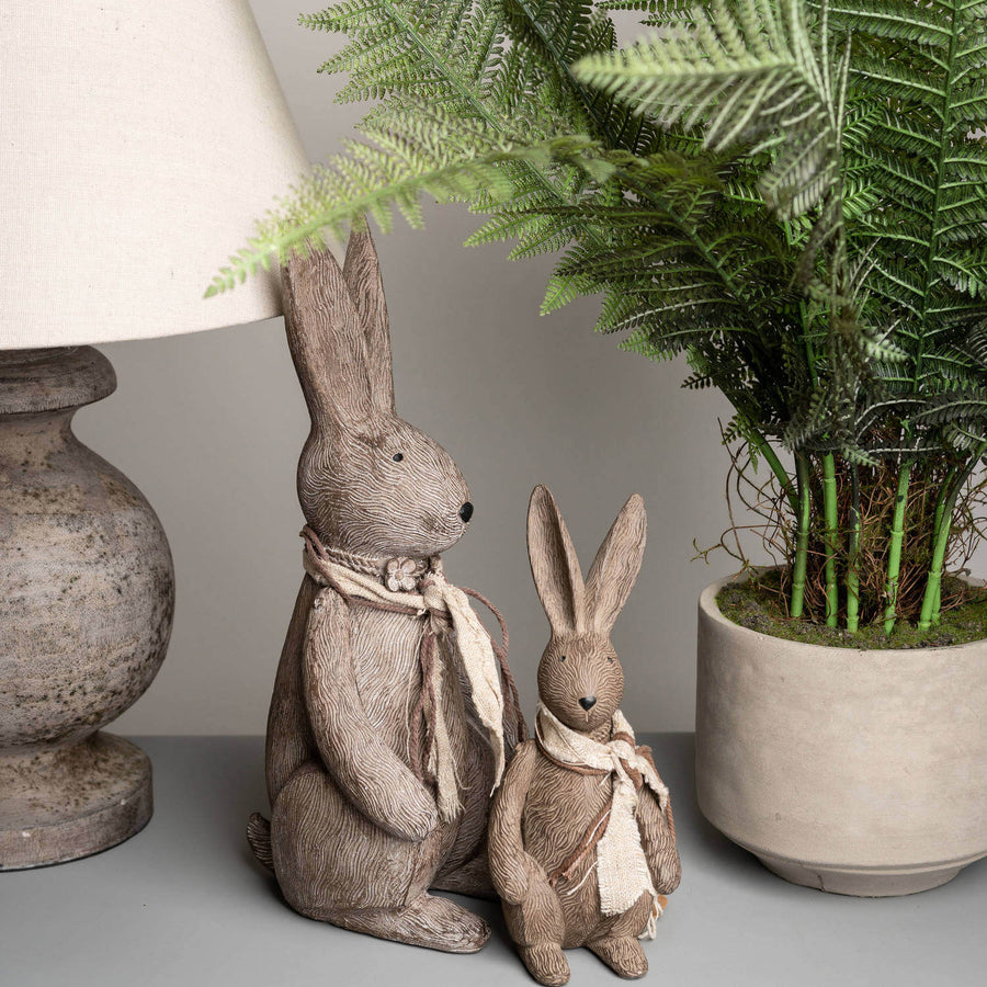 Handcrafted winter bunny rabbit resin figurine in warm brown, sitting pose with lifelike details, perfect for home decor. by Sostter at brixbailey.com