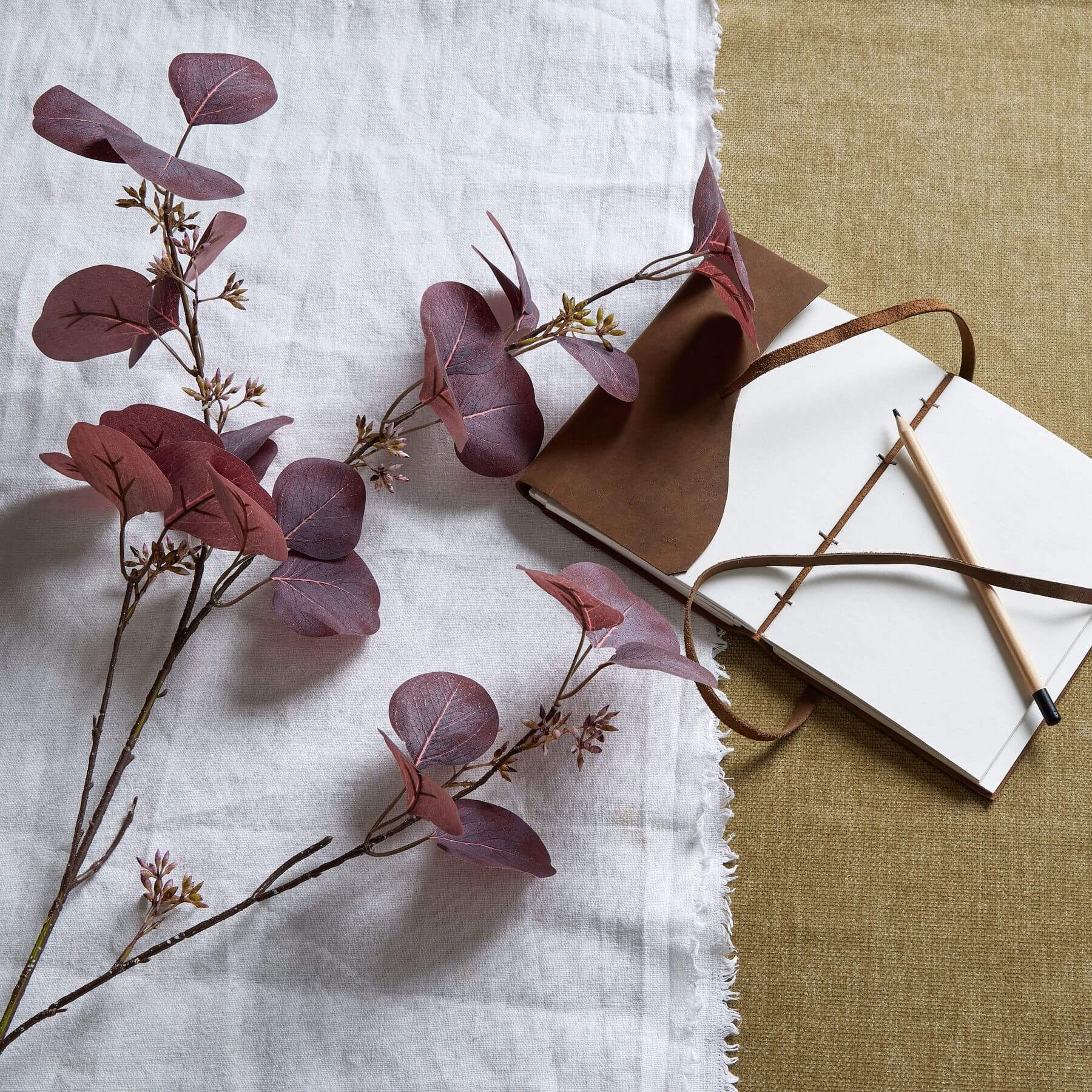 Burgundy berried eucalyptus stem with lifelike plastic leaves and berries, 109cm tall, for seasonal home decor by sostter at brixbailey.com