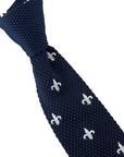 navy blue knitted tie with white embroidered fleur de lis lys design