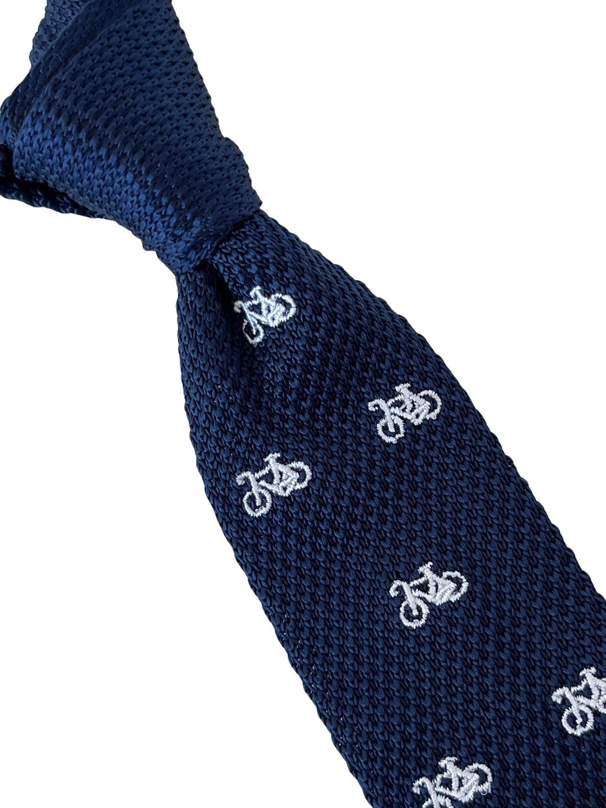 navy blue knitted tie with white embroidered bicycle bike design