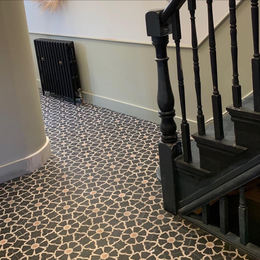 Luxury black cement floor tile with elegant white floral pattern, premium hexagon kitchen and bathroom tiles, best-selling UK delivery by Maria Starling Design at brixbailey.com