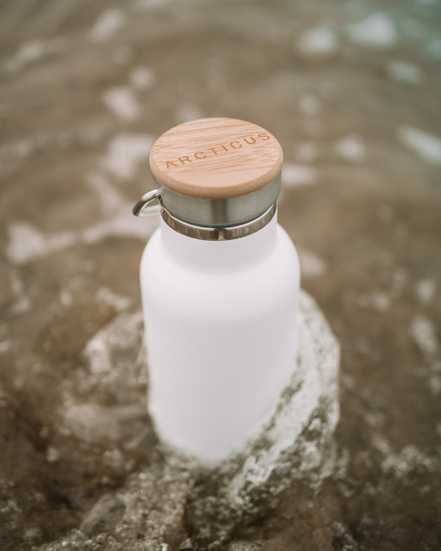 Premium Arctic Bottle, double-wall vacuum-insulated stainless steel, keeps drinks hot or cold, eco-friendly bamboo lid, leak-proof, BPA-free by Arcticus at brixbailey.com