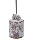 Charming Snow-Covered  Samll Christmas Tree in Rustic Wood Log