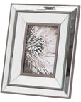 bold close-up of a warm wood and beveled mirror frame for a 5x7 photo