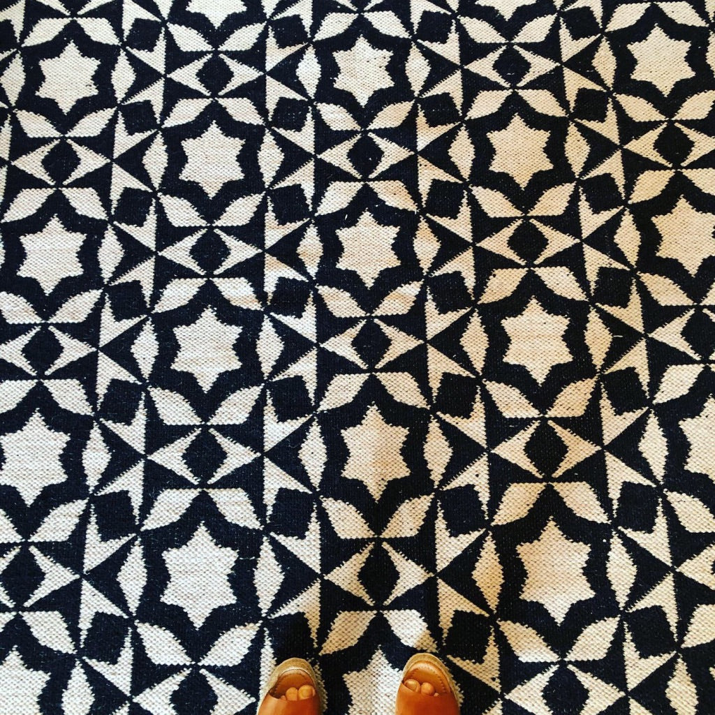Premium monochrome flat weave wool rug, handmade in India, stylish geometric design with tassels, best-selling contemporary decor by Maria Starling Design at brixbailey.com
