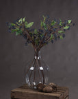 Handcrafted indigo berry stems with deep blue hues, flexible wired branches, and realistic texture for floral arrangements. by sostter at brixbailey.com