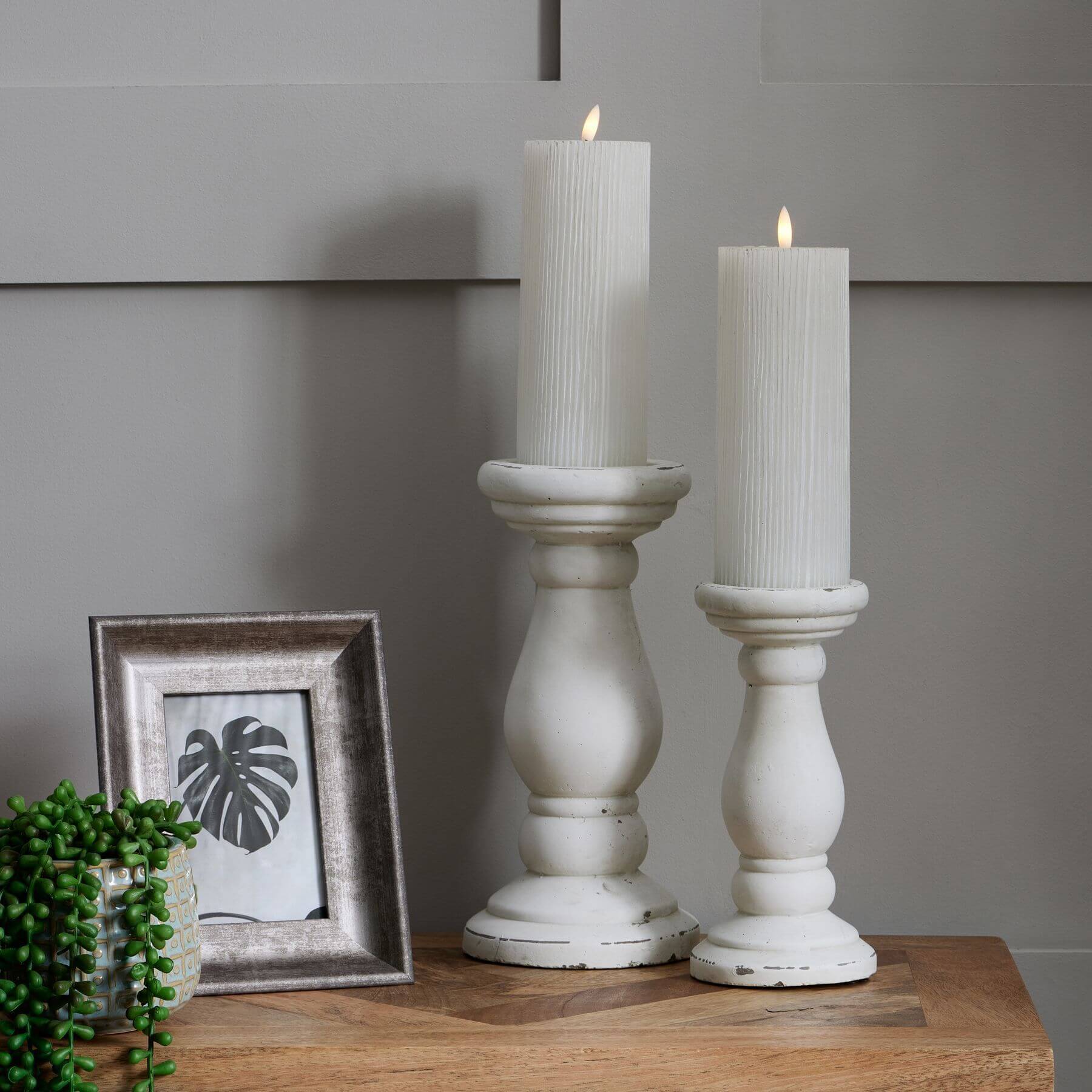 Handcrafted matte white ceramic candle holder with minimalist design for soft light diffusion in home decor. by RoomLondon at brixbailey.com
