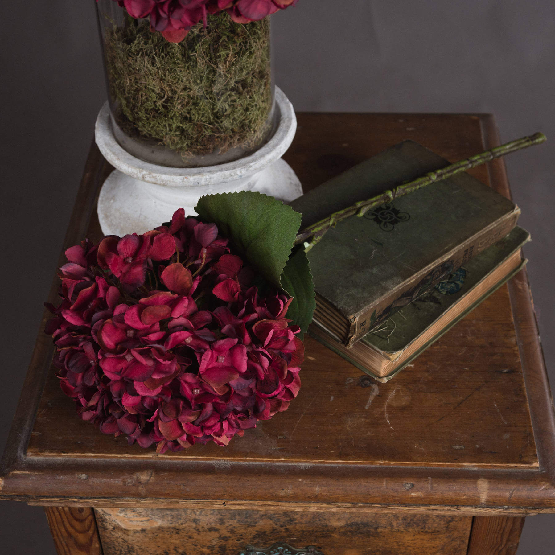 Lifelike ruby red hydrangea stem with hand-painted petals, realistic plastic texture, perfect for home decor by Sostter at brixbailey.com