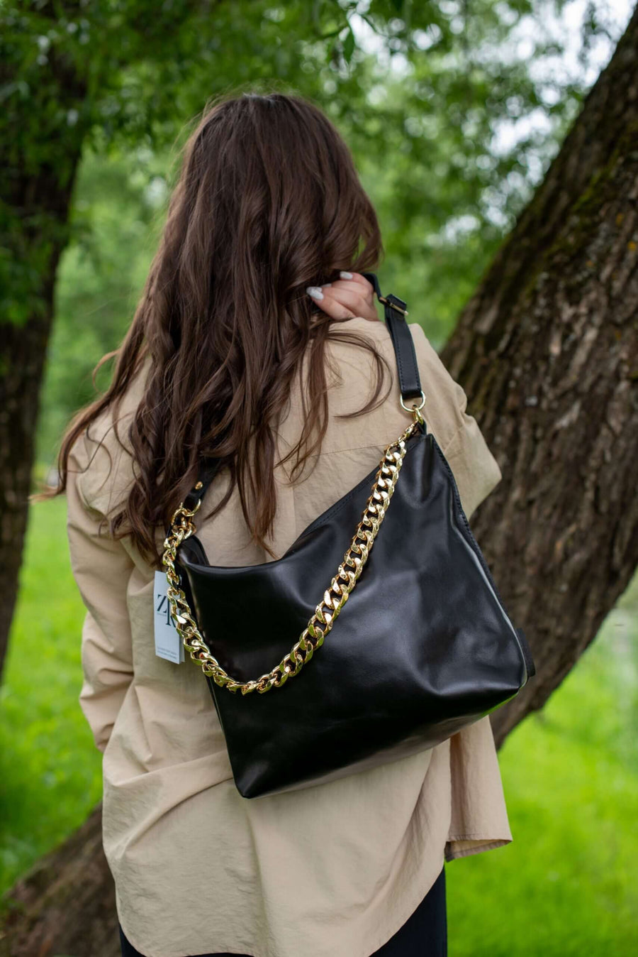 Black Leather Handbag with Metallic Accents, Crossbody