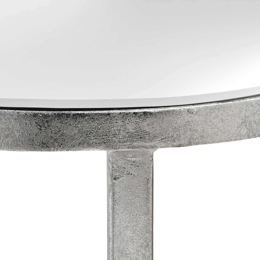Silver mirrored console table with floating half-moon design and cross beams for modern interiors by Sostter at brixbailey.com