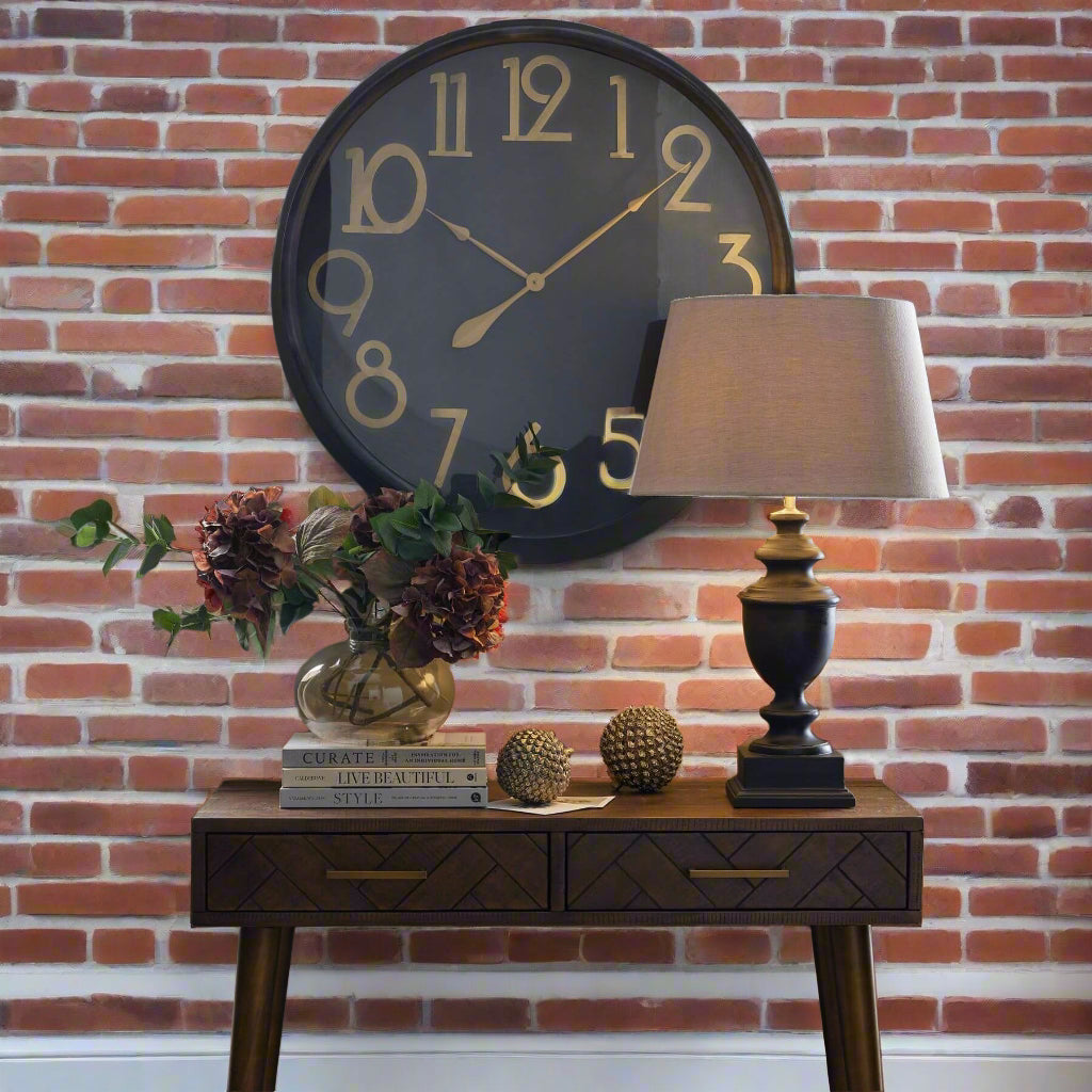 Retro-modern brass numeral wall clock with black face, 80cm diameter, vintage-inspired statement piece for home decor by sostter at brixbailey.com