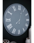 Large grey wall clock with white roman numerals, minimalist metal design, 49cm diameter, modern statement piece by sostter at brixbailey.com