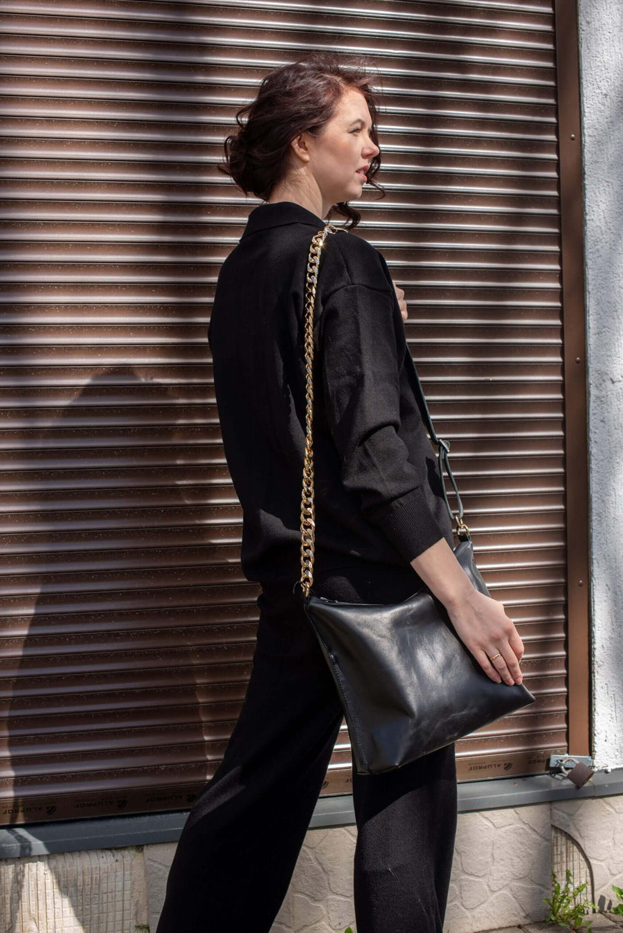 Black Leather Handbag with Metallic Accents, Crossbody