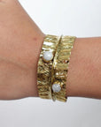 Textured Gold Cuff Bracelet with Gemstone Accents – Handcrafted Adjustable Wrap Design.