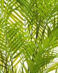 Lifelike faux palm tree in vibrant green with realistic fronds, housed in a modern grey square container, 130cm tall. by sostter at brixbailey.com