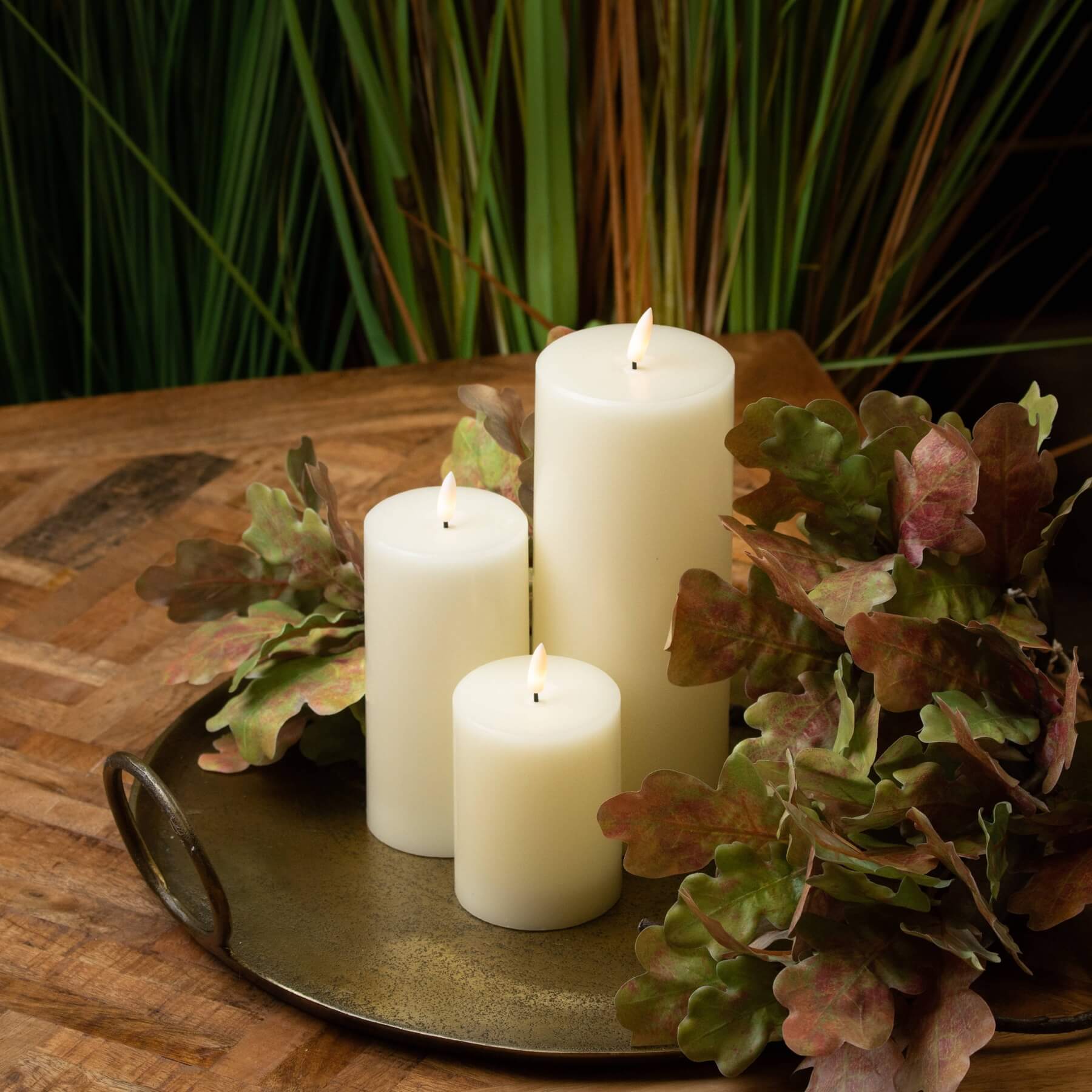 Realistic ivory LED candle with warm amber glow, wax-like finish, and flickering flame effect for safe ambiance by RoomLondon at brixbailey.com