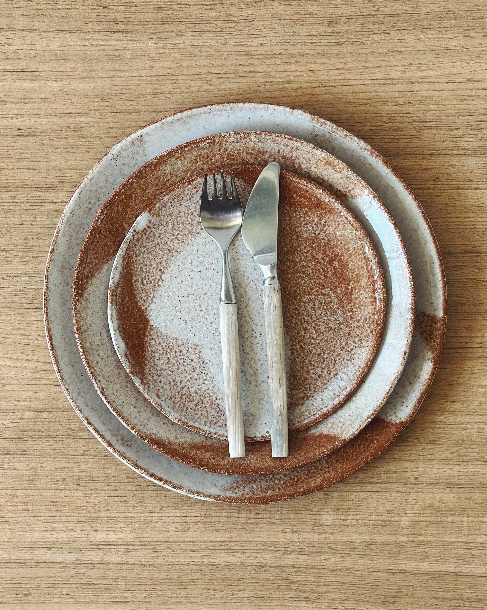 Handmade ceramic plates – caramel clay with white glaze