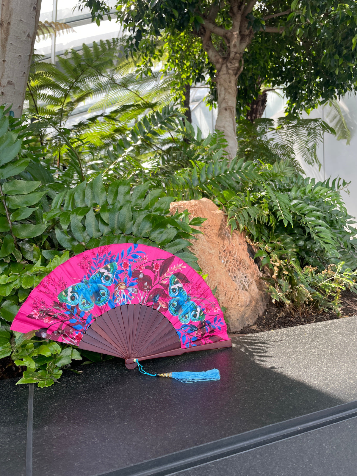 Hot pink 'Fuchsia' silk folding hand fan with butterfly and mushroom painted artwork