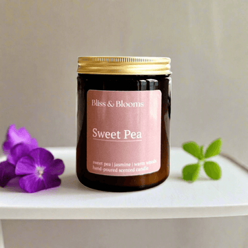 Luxury sweet pea scented candle, handcrafted floral fragrance with hyacinth, jasmine, vanilla, stylish amber glass jar, premium home decor by Bliss & Blooms at brixbailey.com