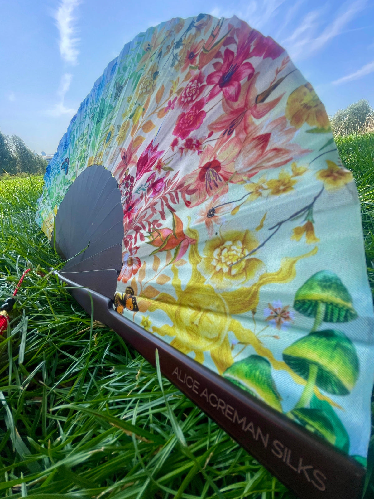 Colourful Silk folding hand fan 'kaleido-bloom' print with floral &amp; nature filled rainbow design