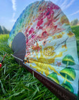 Colourful Silk folding hand fan 'kaleido-bloom' print with floral & nature filled rainbow design