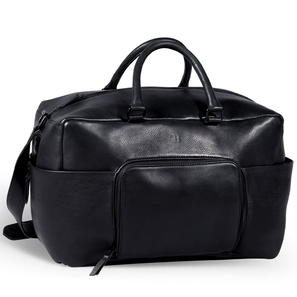 Premium black leather weekender bag, handmade sustainable travel bag with antique brass hardware, spacious compartments, detachable laptop sleeve by Bethikal at brixbailey.com