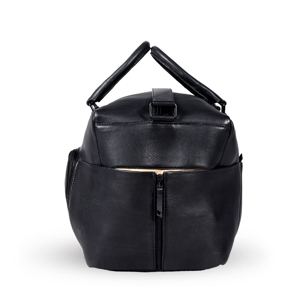 Premium black leather weekender bag, handmade sustainable travel bag with antique brass hardware, spacious compartments, detachable laptop sleeve by Bethikal at brixbailey.com