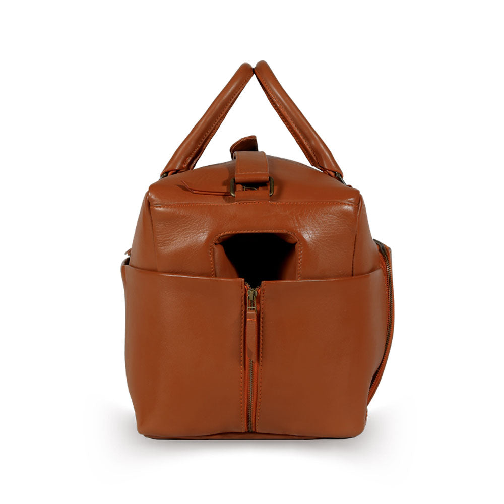 Premium tan leather weekender bag, handmade eco-friendly travel duffle with recycled materials, durable full grain cowhide, antique brass hardware, detachable laptop sleeve by Bethikal at brixbailey.com