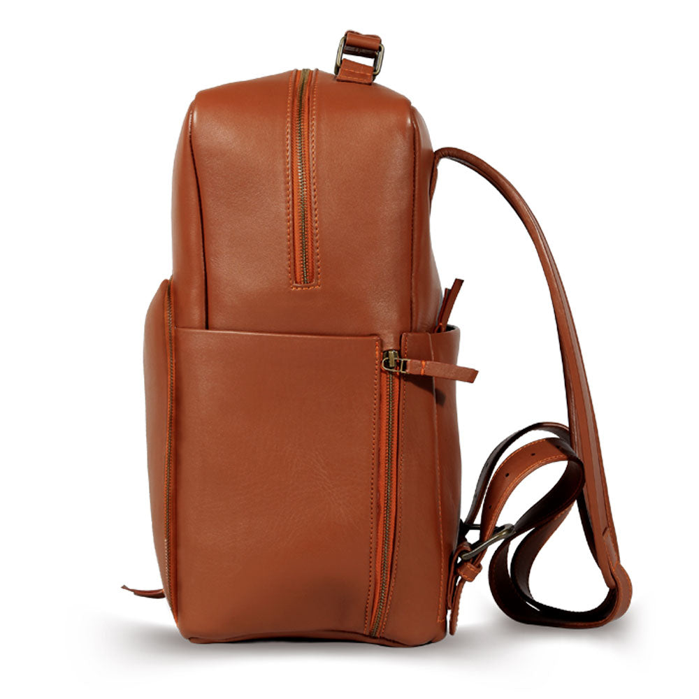 Premium tan leather backpack, sustainable recycled materials, handcrafted full grain cowhide, spacious laptop sleeve, durable antique brass hardware, stylish travel companion by Bethikal at brixbailey.com