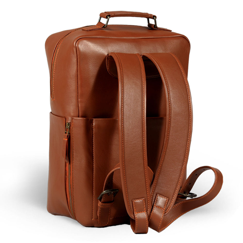 Premium tan leather backpack for travel, handcrafted from recycled full-grain Nappa leather, durable brass hardware, spacious 20L capacity, detachable quilted laptop sleeve, sustainable slow-fashion design by Bethikal at brixbailey.com
