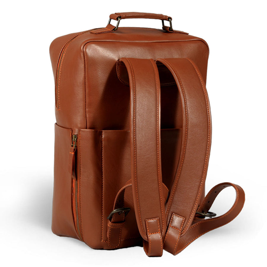 Premium tan leather backpack for travel, handcrafted from recycled full-grain Nappa leather, durable brass hardware, spacious 20L capacity, detachable quilted laptop sleeve, sustainable slow-fashion design by Bethikal at brixbailey.com