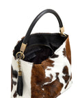 Spotted Cow Calf Hair Tassel Bag – Luxurious & Versatile by Sostter at brixbailey.com