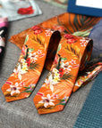 Rust orange coloured Silk Tie, 'Eden' tropical meadow print