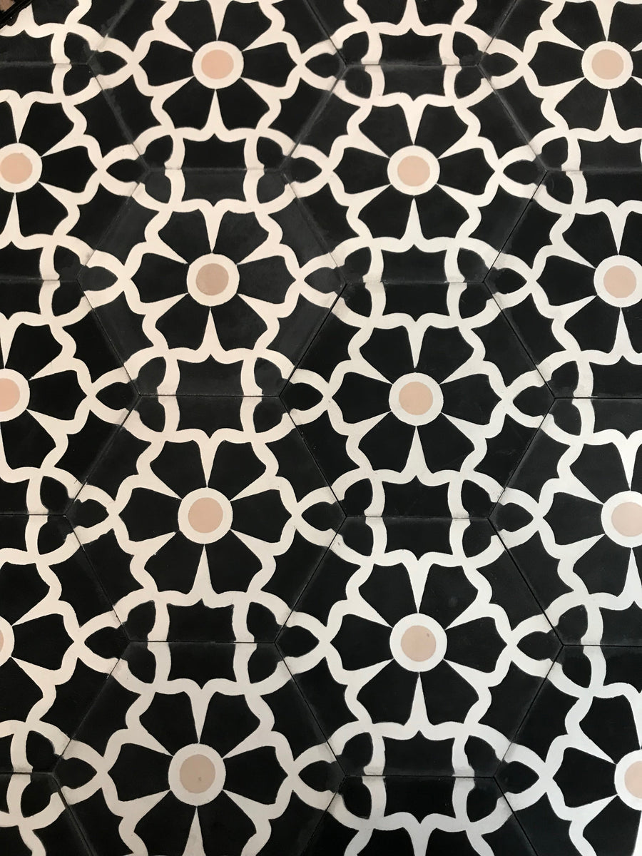 Luxury black cement floor tile with elegant white floral pattern, premium hexagon kitchen and bathroom tiles, best-selling UK delivery by Maria Starling Design at brixbailey.com