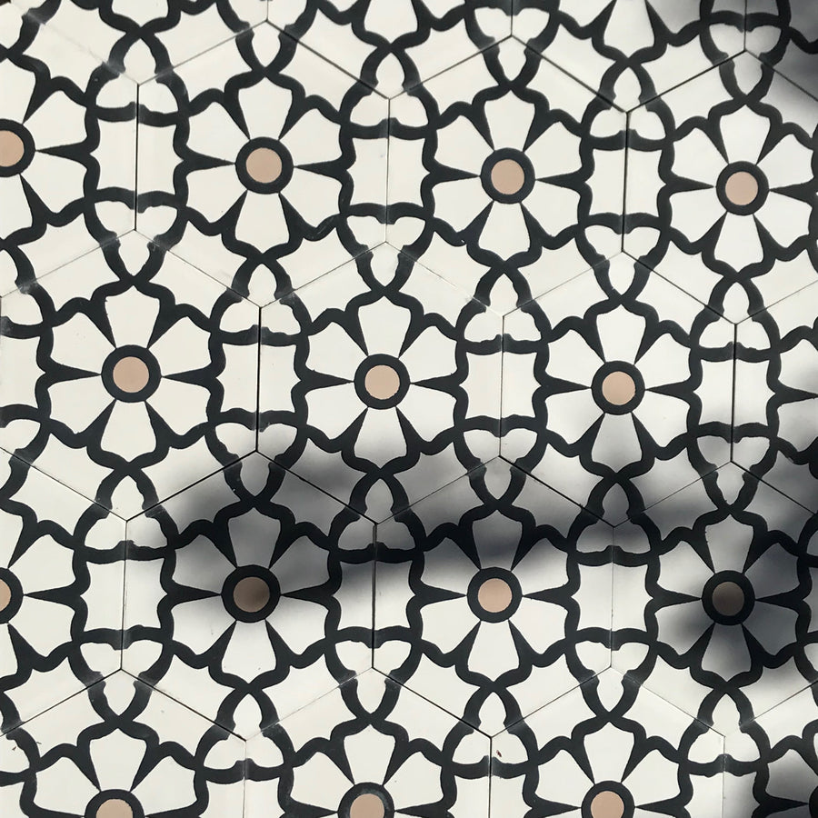 Luxury black cement floor tile with elegant white floral pattern, premium hexagon kitchen and bathroom tiles, best-selling UK delivery by Maria Starling Design at brixbailey.com