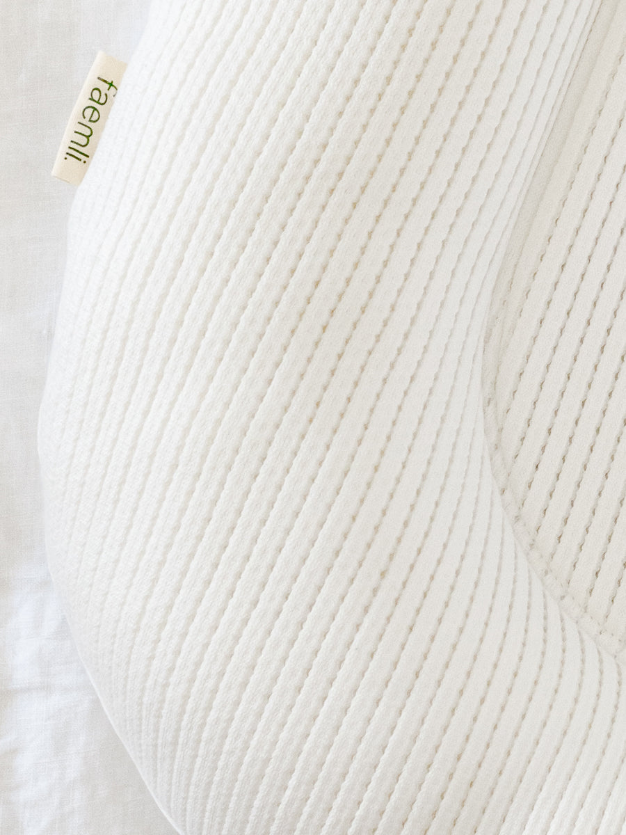premium baby lounger, portable infant nest, soft tencel fabric, lightweight and breathable, best-selling newborn lounger by Faemli at brixbailey.com