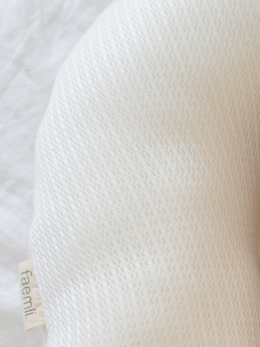 premium baby lounger, portable infant nest, soft tencel fabric, breathable 3D mesh, lightweight polyester fill, reflux relief design by Faemli at brixbailey.com