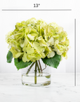 Silk hydrangea centerpiece arrangement in glass vase